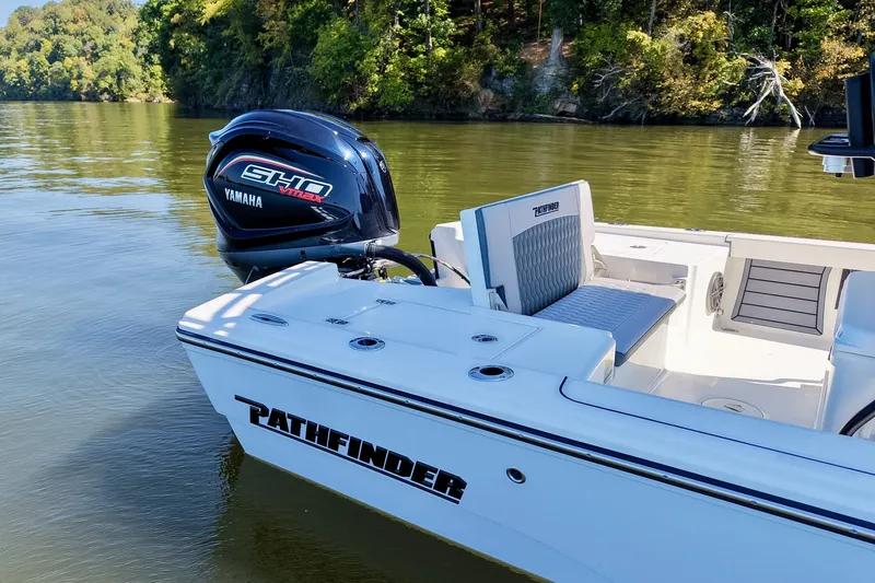 Slide: The Image of 2027 Pathfinder 2200 Hybrid boat with Yamaha engine on a serene lake. - 8