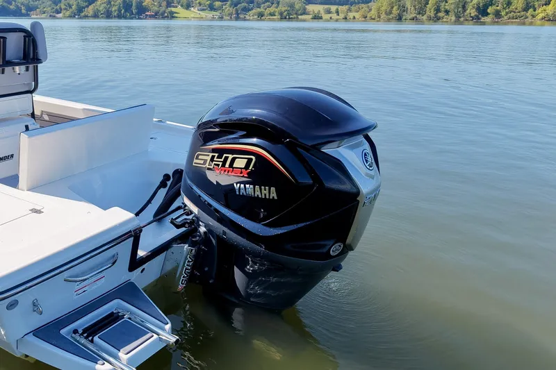 Slide: The Image of 2027 Pathfinder 2200 Hybrid boat with Yamaha SHO VMAX outboard motor on a serene lake. - 11