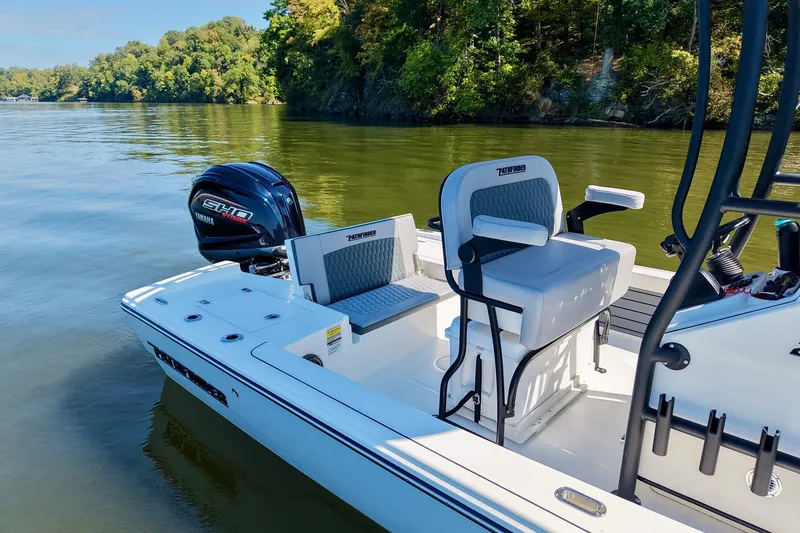 Slide: The Image of 2027 Pathfinder 2200 Hybrid boat on calm lake with Yamaha engine, surrounded by lush greenery. - 7