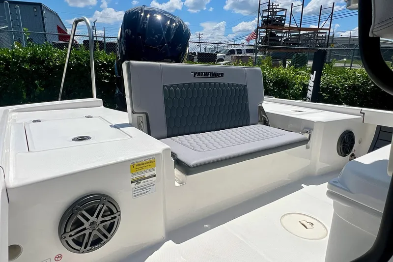 Slide: The Image of 2027 Pathfinder 2200 TRS boat interior with cushioned seating and speaker system. - 14