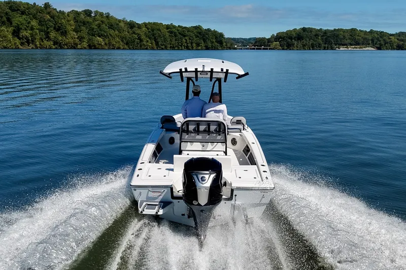 Slide: The Image of Pathfinder 2200 Hybrid boat cruising on a serene lake, 2027 model. - 9