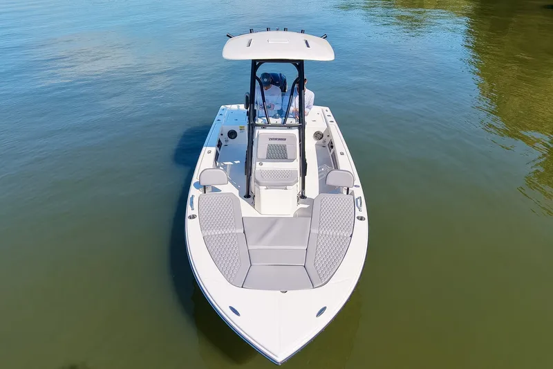 Slide: The Image of 2027 Pathfinder 2200 Hybrid boat on calm water, showcasing sleek design and spacious deck. - 12