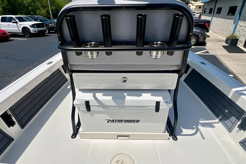 Slide: The Image of 2027 Pathfinder 2200 TRS boat interior with rod holders and storage compartment. - 16