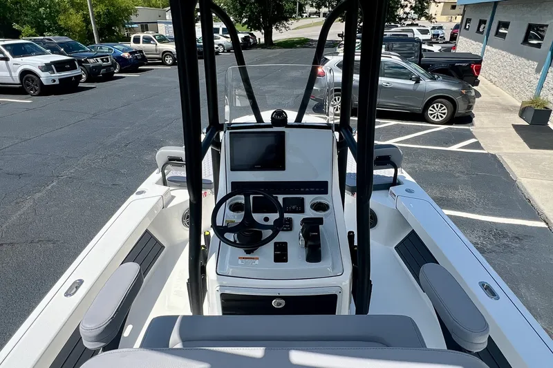Slide: The Image of 2027 Pathfinder 2200 TRS boat interior with steering console and modern controls. - 19