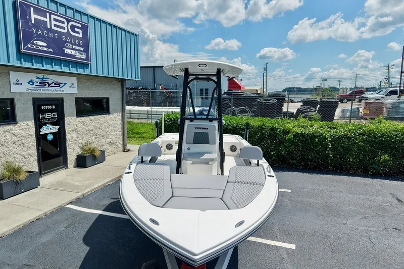 Slide: The Image of 2027 Pathfinder 2200 TRS boat at HBG Yacht Sales under a clear blue sky. - 24