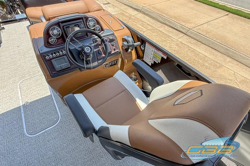 Slide: The Image of Captain's seat and dashboard of 2022 South Bay 523 SB2 ARCH boat. - 16