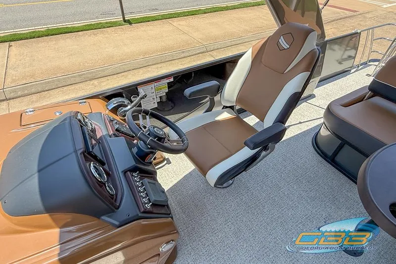 Slide: The Image of Captain's chair and dashboard of 2022 South Bay 523 SB2 ARCH boat. - 17