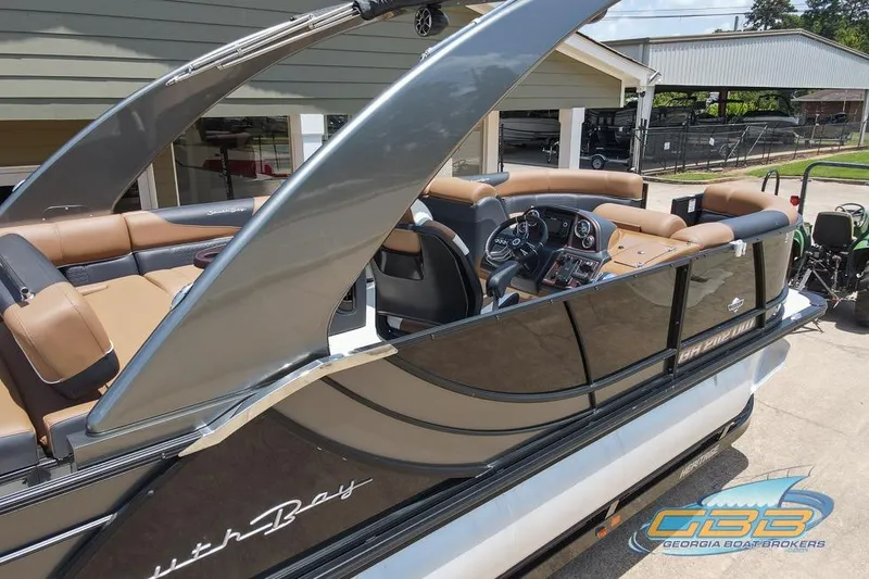 Slide: The Image of 2022 South Bay 523 SB2 ARCH pontoon boat with tan seating and sleek design. - 15