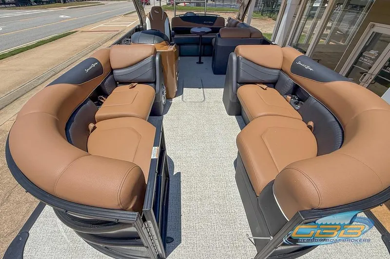 Slide: The Image of 2022 South Bay 523 SB2 ARCH pontoon boat with luxurious tan seating and spacious interior. - 21