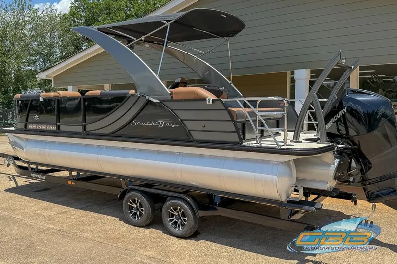 Slide: The Image of 2022 South Bay 523 SB2 ARCH pontoon boat on trailer, featuring sleek design and powerful engine. - 7