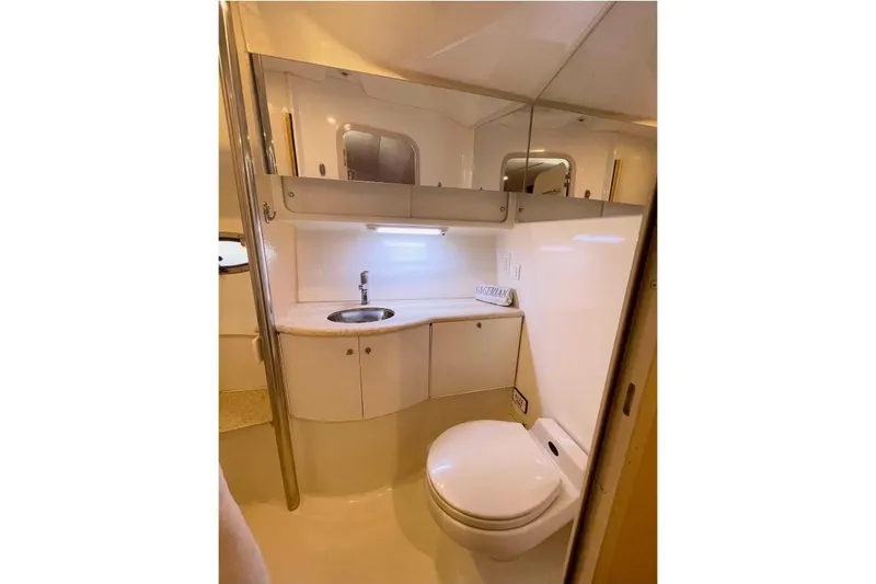 Slide: The Image of Bathroom interior of a 2003 Formula 40 Performance Cruiser, featuring sink and toilet. - 8