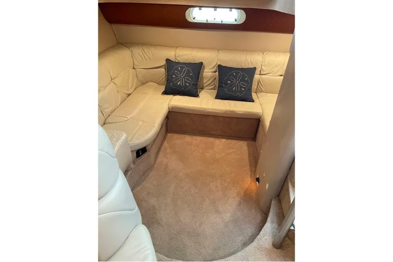 Slide: The Image of Luxurious interior of 2003 Formula 40 Performance Cruiser with beige seating and decorative pillows. - 4