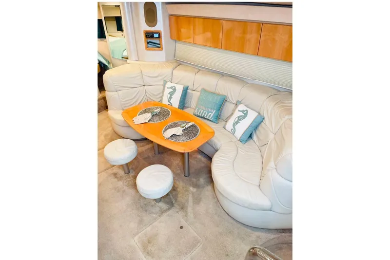 Slide: The Image of Luxurious interior of a 2003 Formula 40 Performance Cruiser with plush seating and decorative pillows. - 12