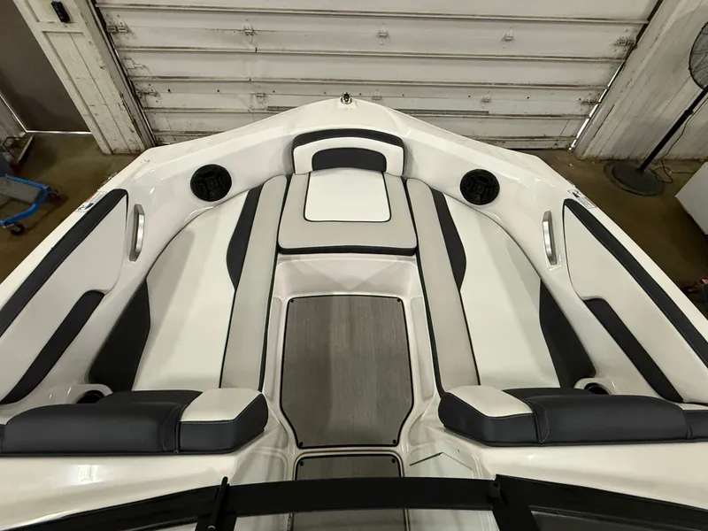 Slide: The Image of The bow of a 2024 Yamaha AR195 boat with cushioned seating and speakers. - 10