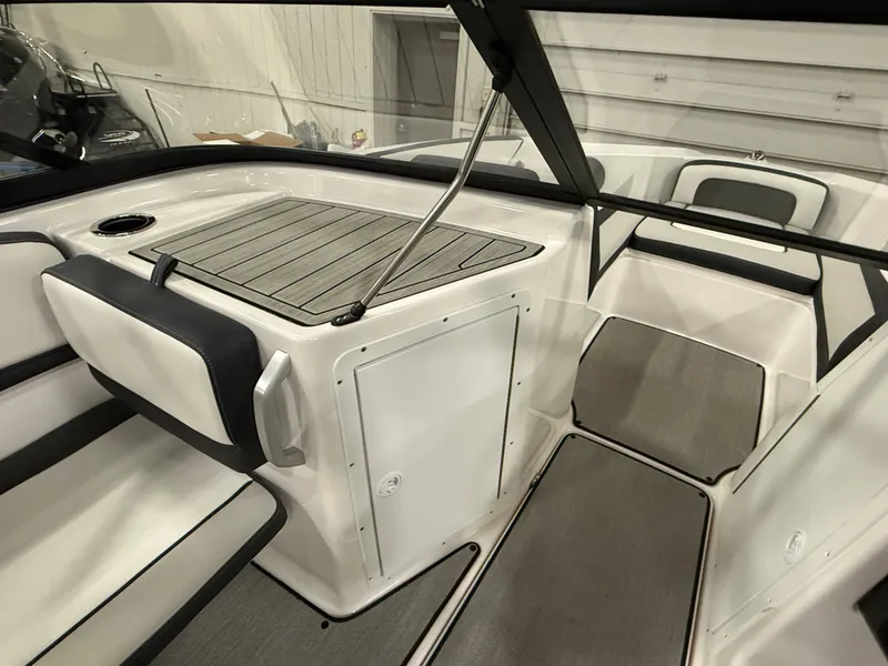 Slide: The Image of The image shows the cockpit of a 2024 Yamaha AR195 boat with modern seating and a table. - 11