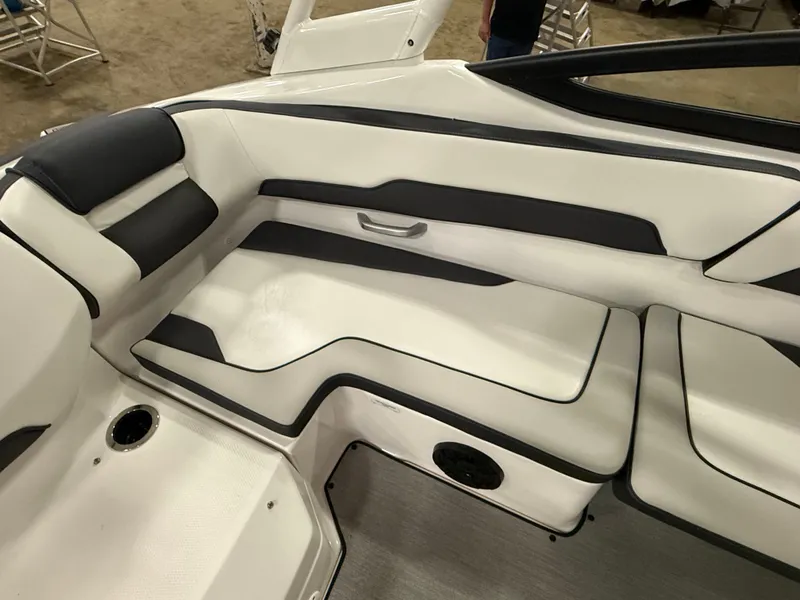 Slide: The Image of The interior of the 2024 Yamaha AR195 features white and black upholstery with a speaker. - 15
