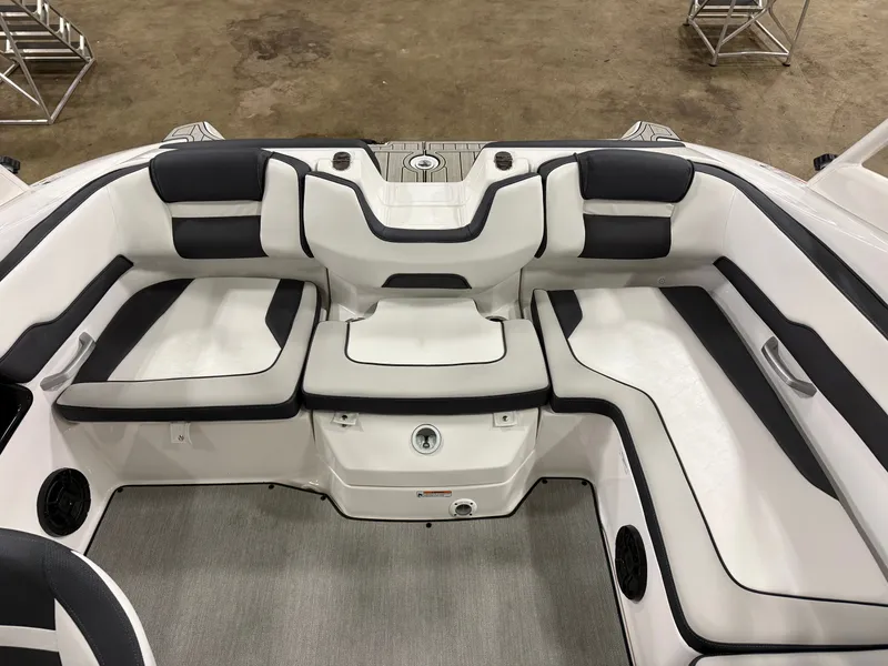 Slide: The Image of The image shows the interior of a 2024 Yamaha AR195 boat with white and black seating. - 6
