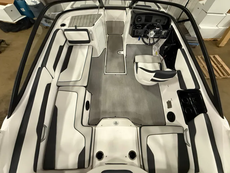 Slide: The Image of The image shows the cockpit of a 2024 Yamaha AR195 boat with gray and white seating. - 17