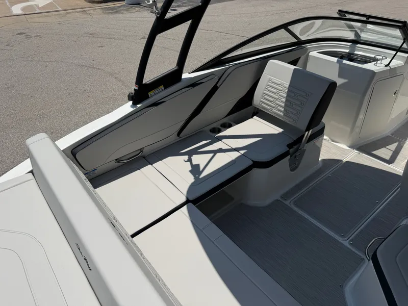 Slide: The Image of The image shows the cockpit of a Sea Ray SPX 210 boat. It features gray upholstery and modern fittings. - 33