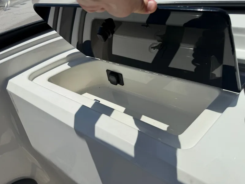 Slide: The Image of An open storage compartment on a 2027 Sea Ray SPX 210 boat. - 39