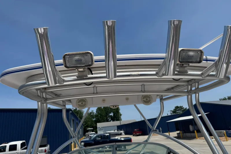 Slide: The Image of 2006 Pro-Line 24 Walkaround boat with rod holders and lights on the T-top. - 11