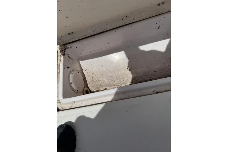Slide: The Image of Dirty storage compartment on a 2006 Pro-Line 24 Walkaround boat. - 15