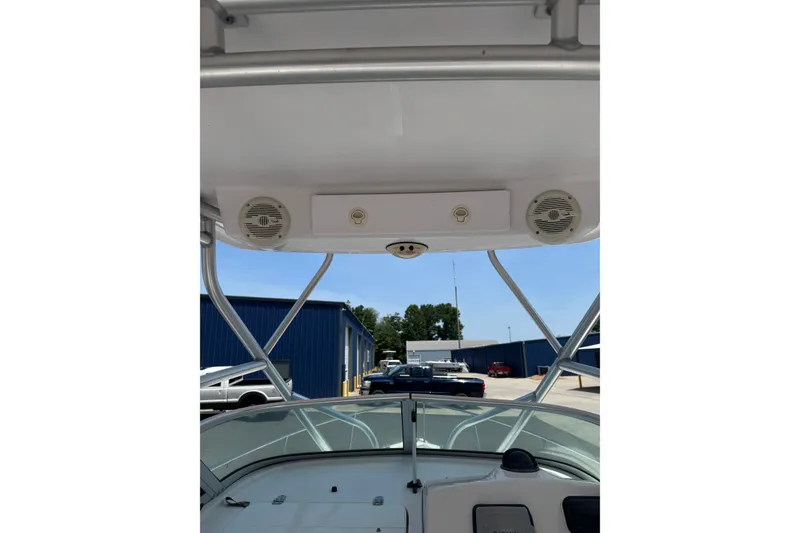 Slide: The Image of 2006 Pro-Line 24 Walkaround boat interior with speakers and overhead view. - 9
