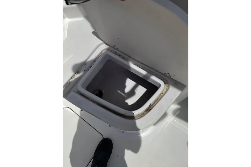 Slide: The Image of Open storage compartment on 2006 Pro-Line 24 Walkaround boat deck. - 17