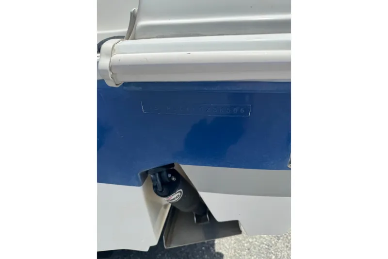 Slide: The Image of 2006 Pro-Line 24 Walkaround boat hull detail with identification number visible. - 4