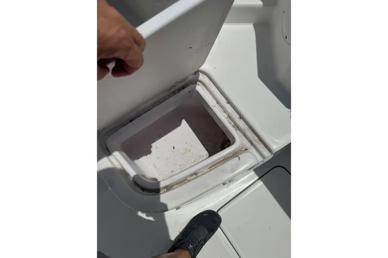 Slide: The Image of Open storage compartment on 2006 Pro-Line 24 Walkaround boat deck. - 16