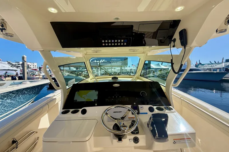 Slide: The Image of 2026 Scout 400 LXF boat cockpit with advanced navigation system and luxurious design. - 10