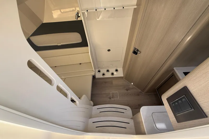 Slide: The Image of Interior of 2026 Scout 400 LXF boat, featuring modern design and wood accents. - 15