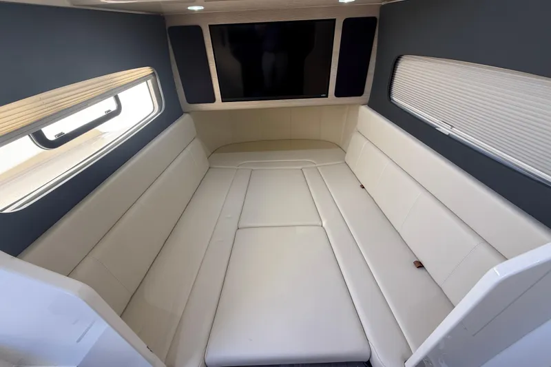 Slide: The Image of Luxurious interior cabin of 2026 Scout 400 LXF boat with plush seating and modern design. - 16
