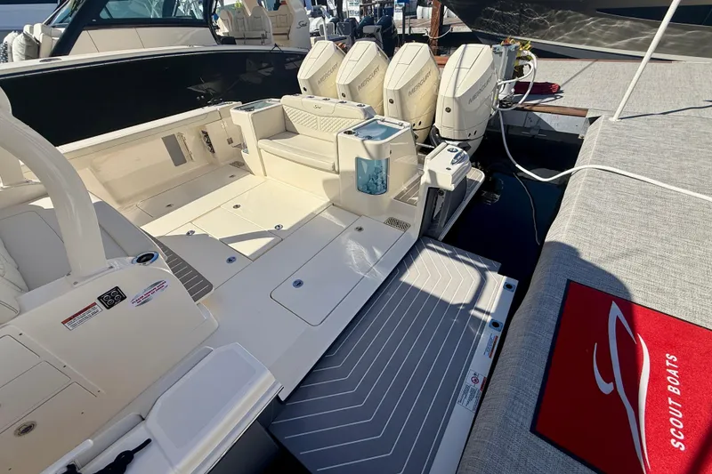 Slide: The Image of 2026 Scout 400 LXF boat with spacious deck and powerful Mercury engines. - 4