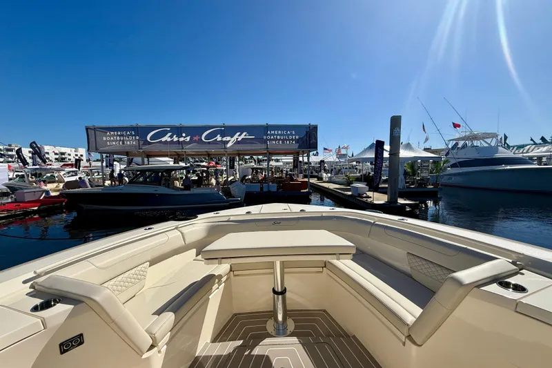 Slide: The Image of 2026 Scout 400 LXF boat at a marina, showcasing luxury seating and Chris-Craft signage. - 14