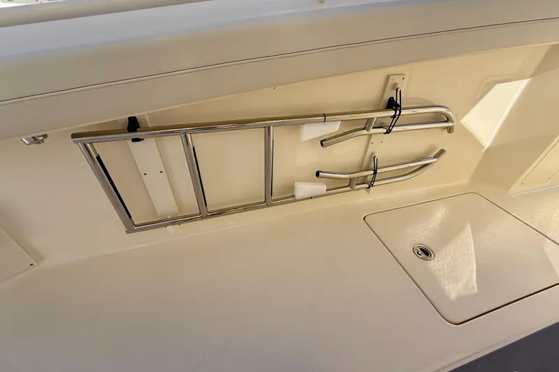 Slide: The Image of 2026 Scout 400 LXF boat interior with stainless steel ladder and storage compartment. - 11