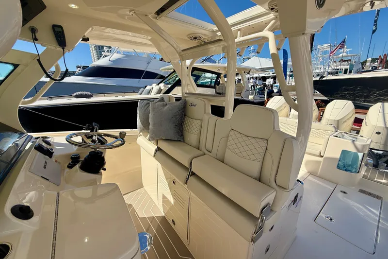 Slide: The Image of Luxurious interior of 2026 Scout 400 LXF boat with plush seating and modern helm. - 9