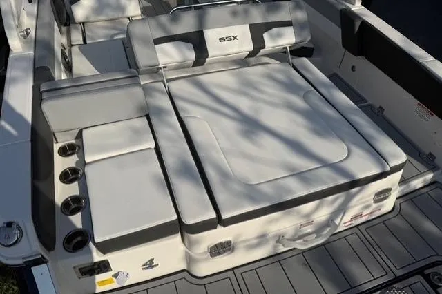 Slide: The Image of 2026 Chaparral SSX 4 boat interior with cushioned seating and cup holders. - 14