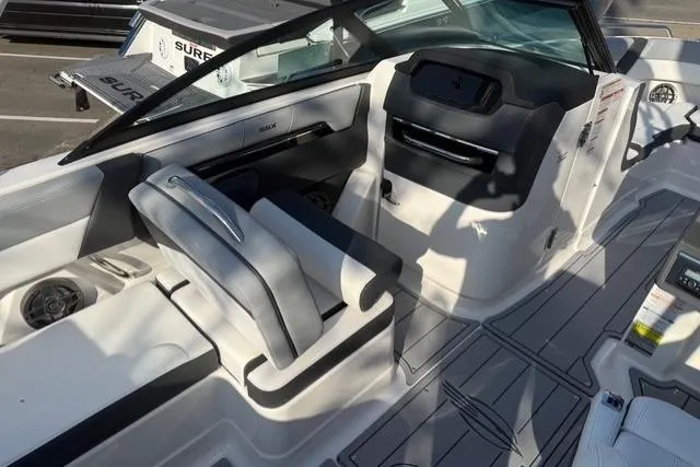 Slide: The Image of 2026 Chaparral SSX 4 boat interior with sleek seating and modern dashboard design. - 12