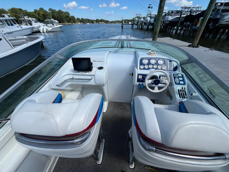 Slide: The Image of The image shows the cockpit of a 2004 Formula 292 FASTech boat with two seats and a helm. - 5