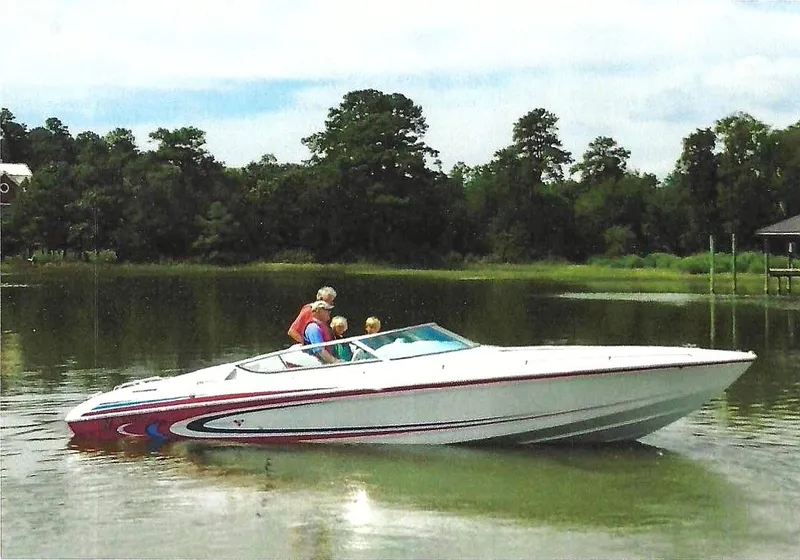 The Image of 2004 Formula 292 FASTech on calm water with three people on board. - 0