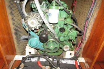 Slide: The Image of Engine compartment of a 1993 Beneteau Oceanis 370 sailboat, showcasing mechanical components. - 19
