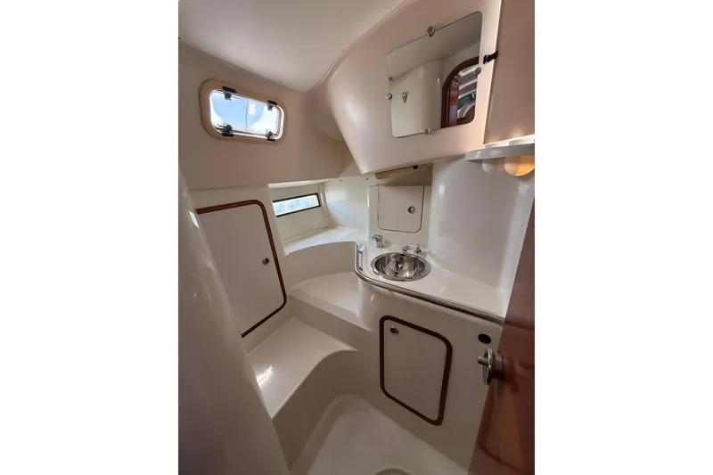 Slide: The Image of Bathroom interior of 1993 Beneteau Oceanis 370 yacht, featuring sink and storage. - 15