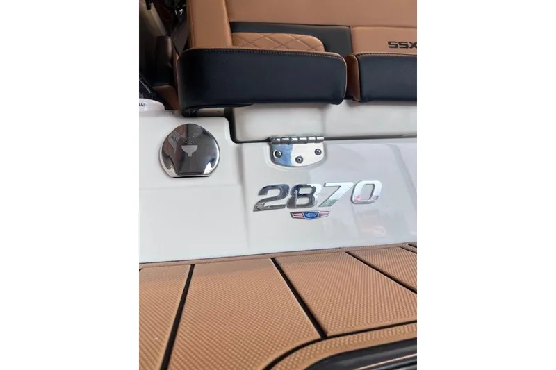 Slide: The Image of 2025 Chaparral 2870 SSX boat interior with logo and seating detail. - 4