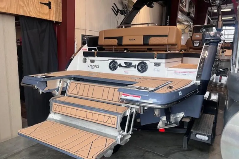Slide: The Image of 2025 Chaparral 2870 SSX boat with extended swim platform and luxurious seating. - 7