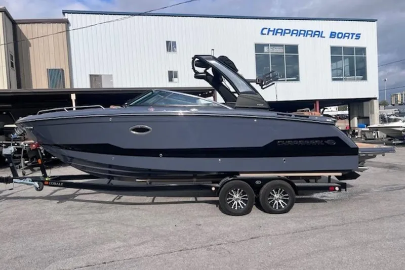 The Image of 2025 Chaparral 2870 SSX boat on trailer outside Chaparral Boats building. - 1