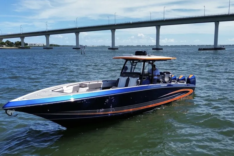 The Image of 2023 Fountain 38 SC boat on water near a bridge, sunny day. - 0