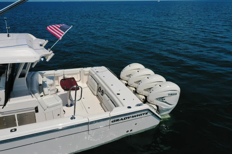Slide: The Image of 2019 Grady-White Canyon 456 boat with Yamaha engines on open water. - 11