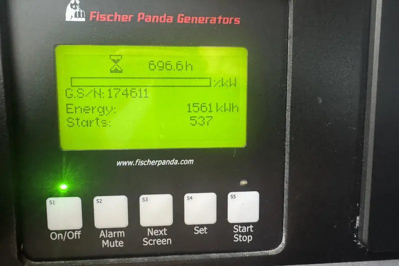 Slide: The Image of Fischer Panda generator display showing 696.6 hours, 1561 kWh energy, on a 2019 Grady-White Canyon 456. - 44