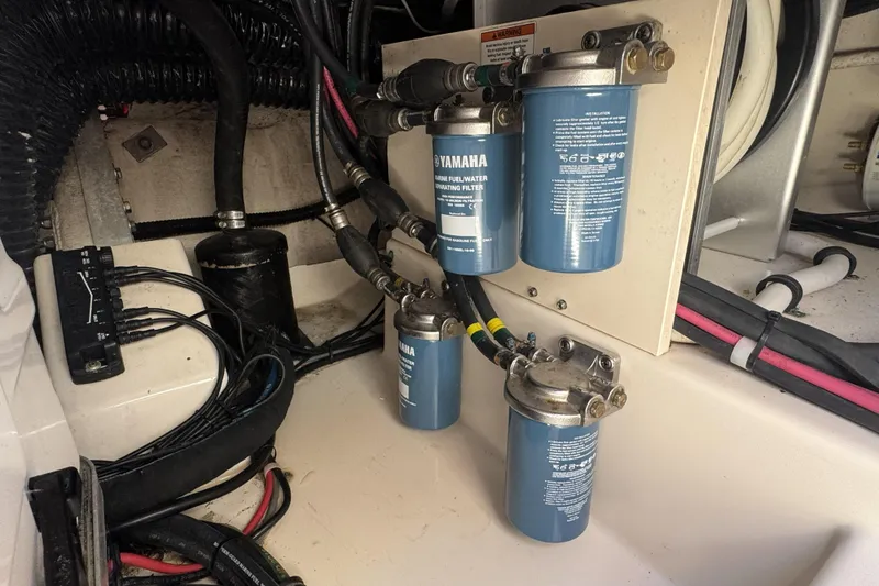 Slide: The Image of Engine compartment of 2019 Grady-White Canyon 456 with Yamaha fuel filters. - 49